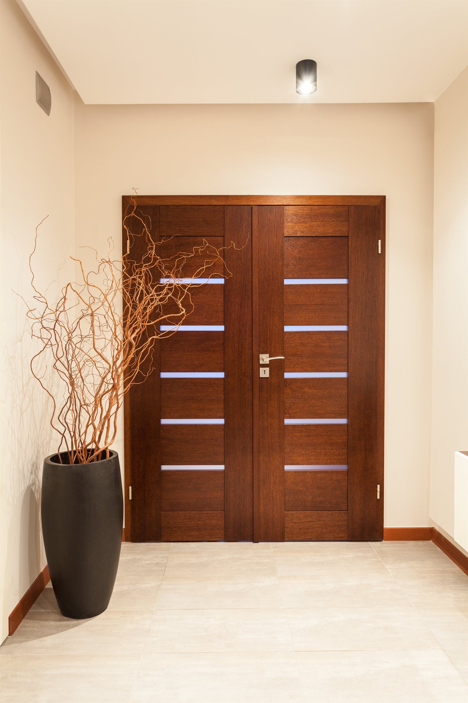 J. Legalos Private Consultation Client Salon and Entryway with Architectural Wooden Door